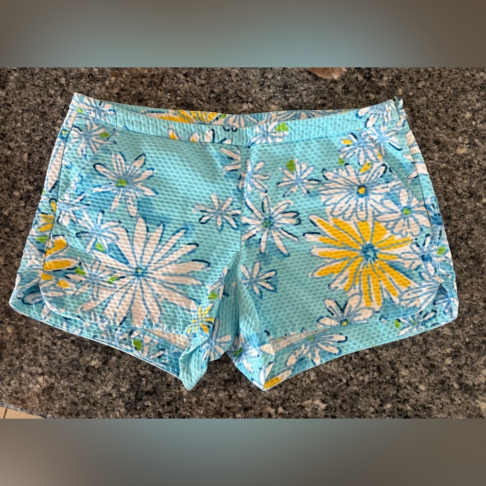 Adie shorts in a "Breakwater Blue Daisy Dance" by lily Pulitzer